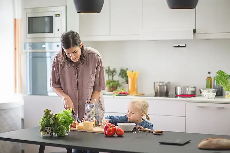 Safera Sense stove guard installed on the bottom of cooker hood