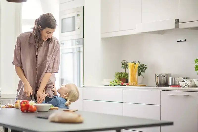 Safera Sense stove guard installed on the bottom of cooker hood
